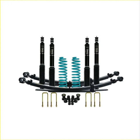 Black and teal coilover suspension kit with four shock absorbers springs and mounting hardware for toyota landcruiser 78 series