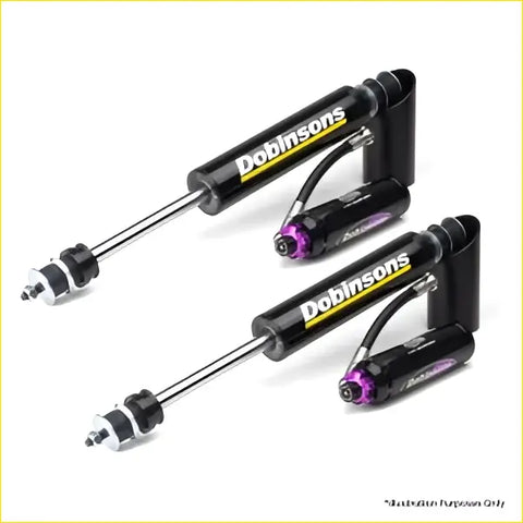 Black and purple dobinsons performance shocks with chrome finish for toyota landcruiser 78 series shown from back side