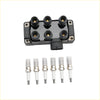 Black ignition coil with six spark plug terminals and six white ceramic spark plugs for ford explorer sport trac fd480