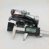 Silver metallic door lock actuator with wiring and digital caliper measuring width for toyota hilux 1983-1988