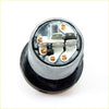 Back side of a silver cylindrical automotive headlight bulb socket with black rubber base for Nissan Datsun ignition keys