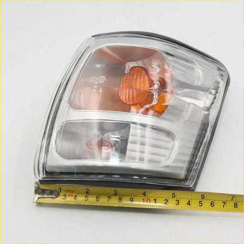 Indicator corner light x2 for toyota hilux ln166 d4d 2001-2004 clear plastic amber lens with black rubber trim rectangular design