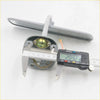 Backside of gray plastic doorbell push button with brass component and wiring for Toyota Hilux interior mirror 1978-1983