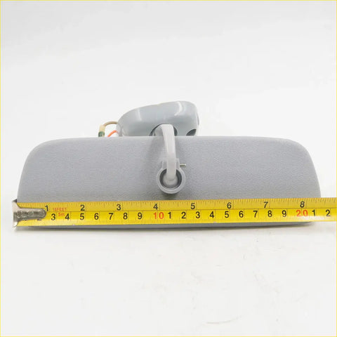 Gray plastic interior rear view mirror for toyota hilux 1978-1983 showing back with mounting bracket and attached wiring