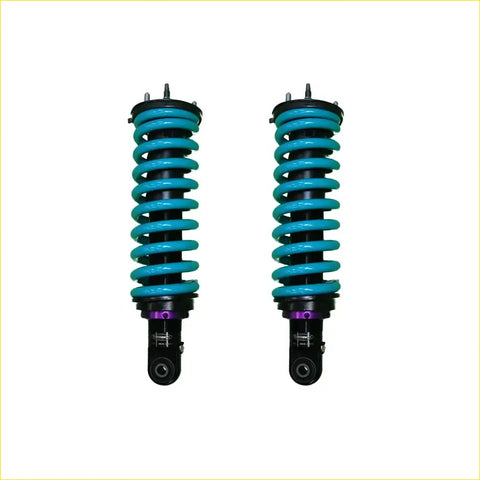 A pair of turquoise dobinsons ims monotube coil-over shocks with black and purple accents for isuzu dmax front lift