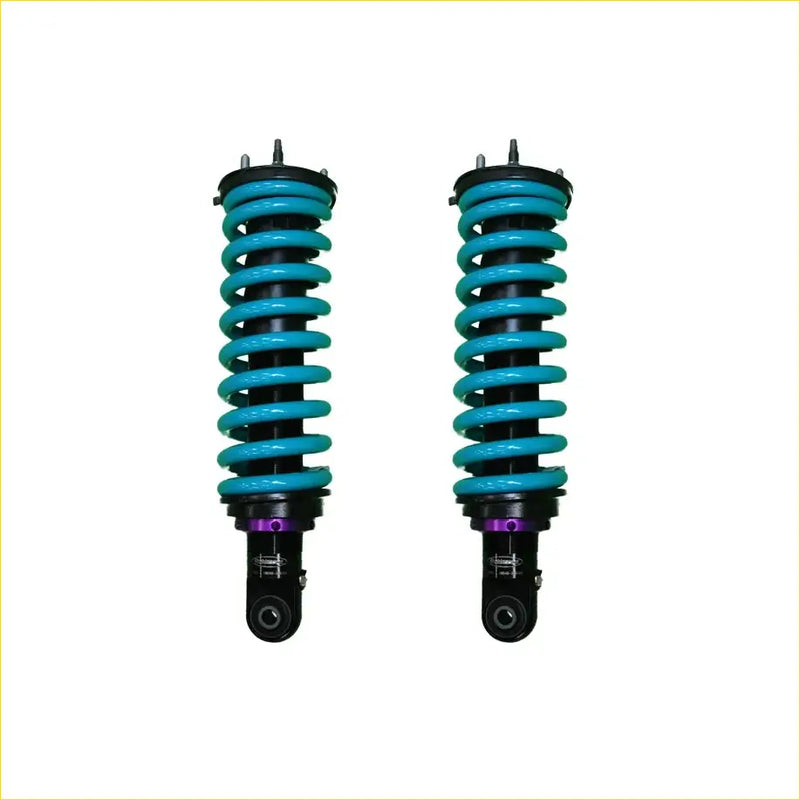 A pair of turquoise dobinsons ims monotube coil-over shocks with black and purple accents for isuzu dmax front lift