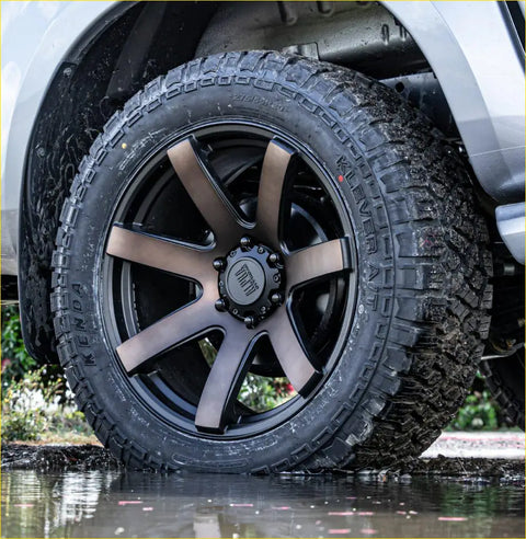 Black kenda klever at 285 50 r20 tire mounted on matte black and bronze multi spoke alloy wheel