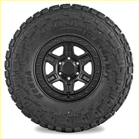 Black kenda klever mt2 33x12.5 r20 tire mounted on a black alloy wheel for off road use