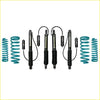 Set of four black shock absorbers with teal coil springs for landcruiser 80 series off-road suspension