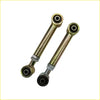Two gold metal control arms with black rubber bushings and silver rings for landcruiser 80 series dobinson nitro gas lift