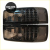 Pair of black smoked led taillights with modern grid pattern for toyota land cruiser shown from the back side