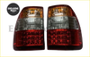 Pair of red and amber led tail lamps with clear lens sections for toyota land cruiser lc100 back side view