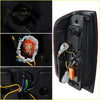 Black plastic led tail lamp light for nissan navara d40 with red trim and orange circuit board connectors back side view