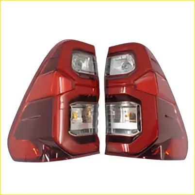 Red plastic led tail light assembly with clear lens for toyota hilux sr5 cruiser 2020 shown from the back side