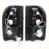 Black plastic led tail light x2 with internal wiring and bulb sockets for Toyota Hilux MK4 MK5 1988-1997 backside view