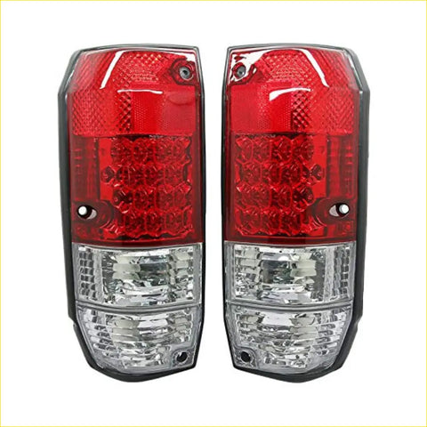 Led tail lights pair with red and clear textured lenses mounted on black plastic housings back side shown