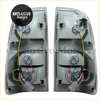 Gray plastic left and right tail light brake lamps with red and white trim and wiring for toyota hilux 2005-2015 back side
