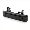 Back side of lh black plastic exterior door handle with rectangular pull tab and spring for mazda bravo 85-96