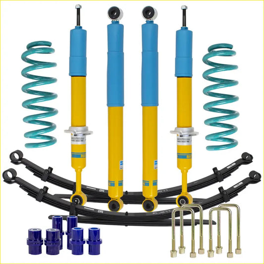 Blue and yellow bilstein b6 shock absorbers with teal coil springs in lift junkie 2 inch lift kit for volkswagen amarok