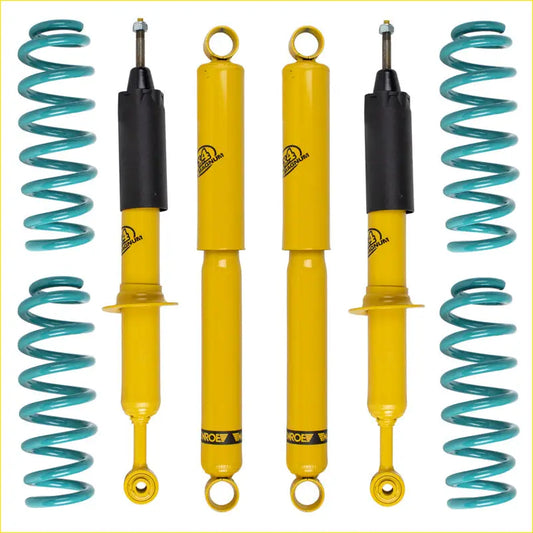 Set of four yellow and black shock absorbers with teal coil springs branded roe for 2 inch lift kit on toyota hilux surf 185