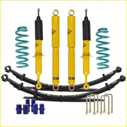 Yellow and black shock absorbers with teal coil springs in lift junkie 2 inch lift kit for toyota hilux n70 kun26