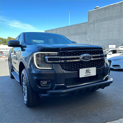 Black ford f-150 pickup with chrome grille and rugged front bumper featuring a low bar nudge bar ford ranger 2022+ black