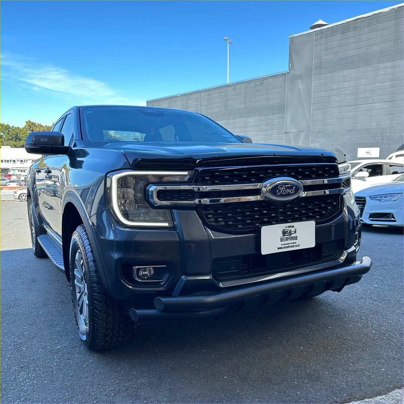 Black ford f-150 pickup with chrome grille and rugged front bumper featuring a low bar nudge bar ford ranger 2022+ black