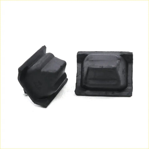 Black rubber lower spring bumpers for Toyota Hilux 1988-1997 with raised dome and angular corner protectors