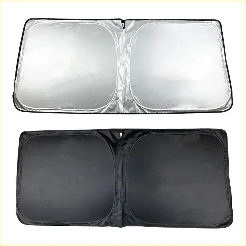 Silver reflective magnetic windscreen sun shade with black fabric backing and reinforced edges for 78 series 1999+