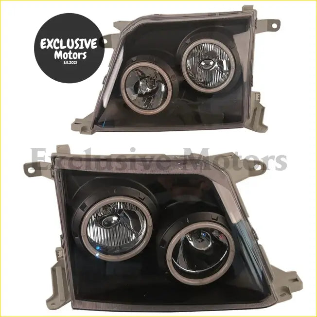 Modified black plastic headlight assemblies with two chrome-rimmed lenses for toyota land cruiser prado 1998-1999