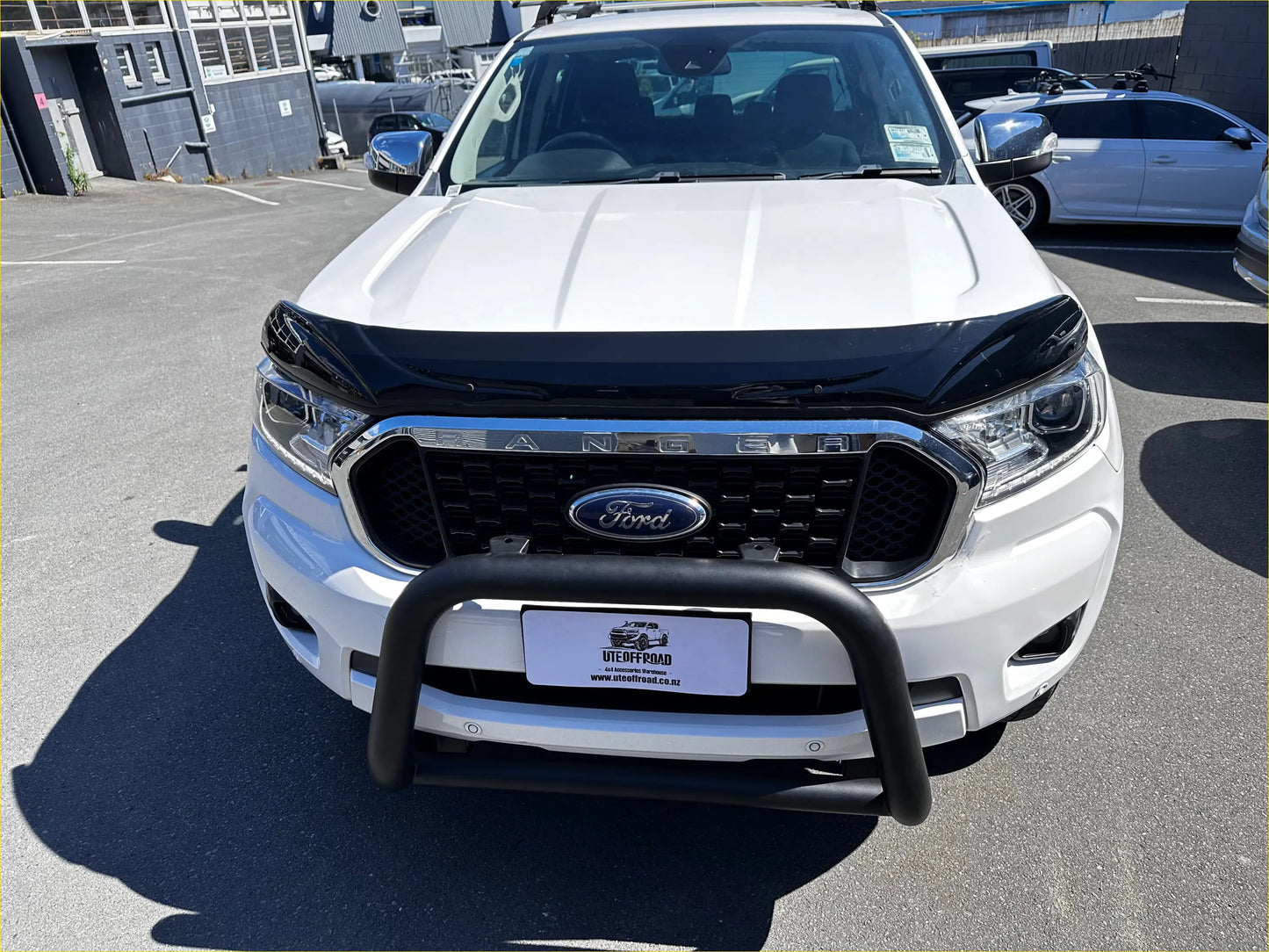 White ford ranger wildtrak with black monsoon bonnet guard and chrome grille for aftermarket style px2 px3