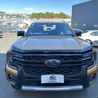 Ford ranger 2022+ with monsoon and bonnet guard featuring a two-tone black and gold metallic finish