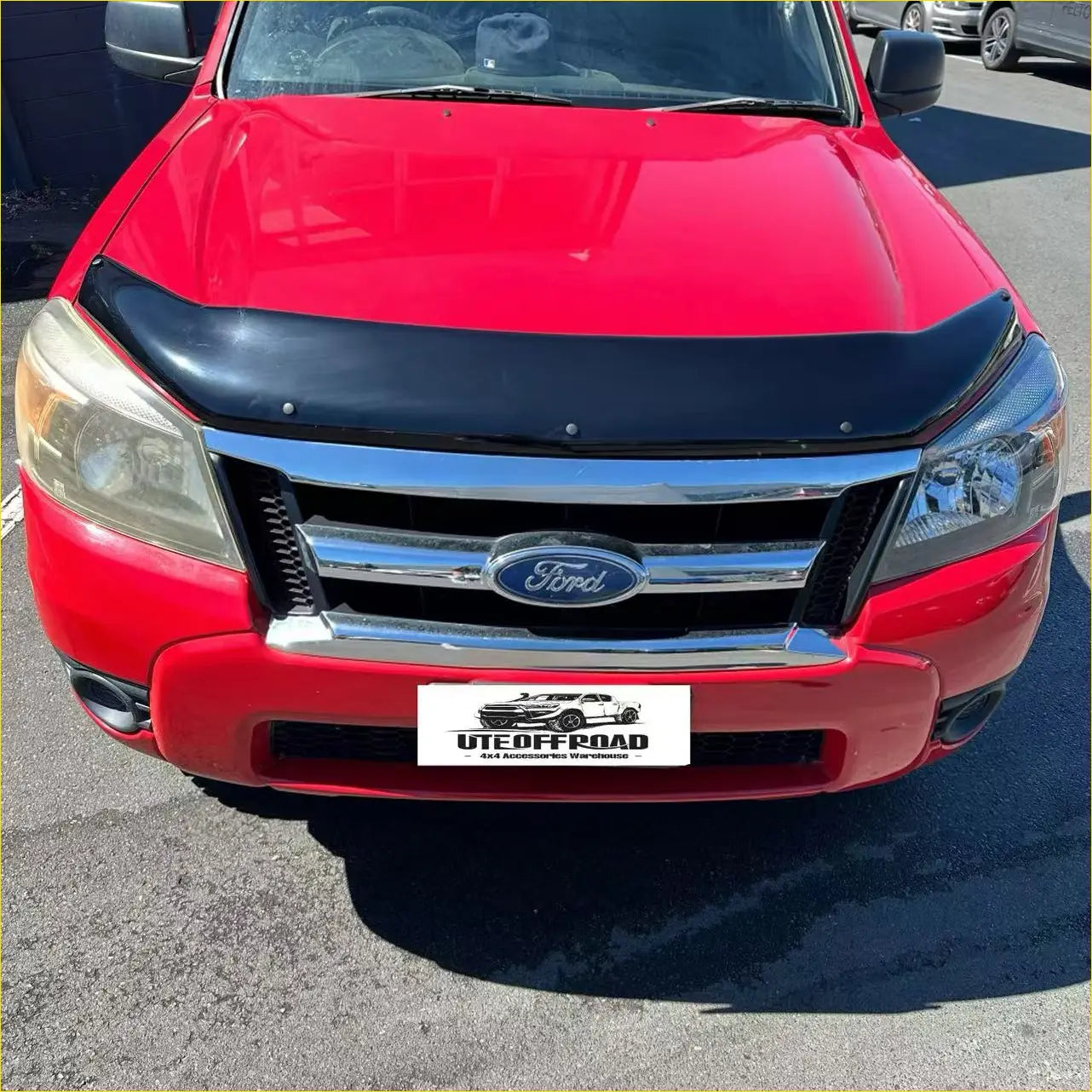 Red ford ranger pk 2008-2011 with monsoon bonnet guard black hood protector and chrome grille front view