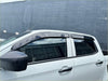 Black plastic window visors installed on a white isuzu d-max 2024 plus pickup truck for monsoon and bonnet guard use