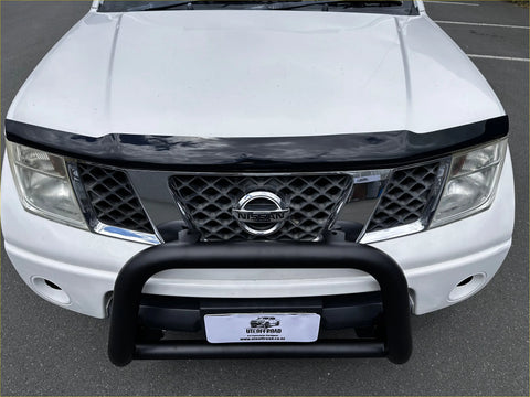 White nissan frontier with black front bumper guard and grille featuring monsoon and bonnet guard for navara d40