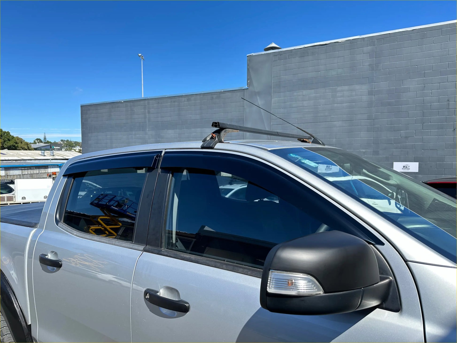 Silver ford ranger px2 px3 pickup with monsoon bonnet guard black side mirrors and roof rack 2016-2021 model