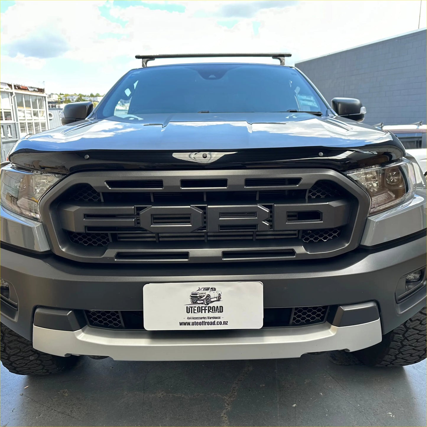 Black matte ford ranger px2 px3 2016 2021 with monsoon bonnet guard and rugged off-road grille design