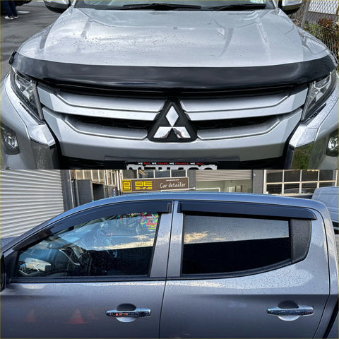 Silver mitsubishi triton pickup with black front bumper guard and side window visors monsoon bonnet guard oem style 2019-2023