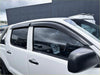 Black plastic window visors installed on white toyota hilux 2012-2015 with monsoon and bonnet guard kit