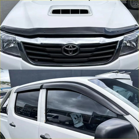 Black plastic window visor for white toyota hilux 2012-2015 shown from the back side in monsoon and bonnet guard set