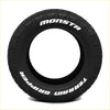 Black rubber monsta terrain gripper a t tire with aggressive tread and white lettering on sidewall in size 285 50 r20