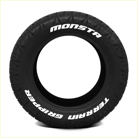 Black rubber monsta terrain gripper a t tire with aggressive tread and white lettering on sidewall in size 285 50 r20