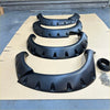 Black plastic monster flare bolt style fender flares with matte finish and vent cutouts for toyota hilux vigo 2012-2015