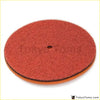 Red circular polishing pad with textured abrasive surface and orange rubber backing for mushroom air filter foam sponge
