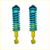 A pair of vibrant teal and yellow coil-over shock absorbers with black top mounts for nissan navara frontier d40