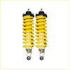 Pair of bright yellow coil-over shocks with black top mounts and white bodies for nissan pathfinder r51 diesel 2.5l tdi