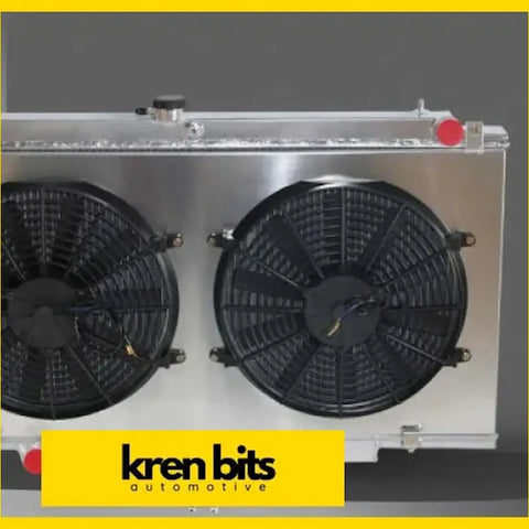 Silver aluminum radiator with two black cooling fans mounted on either side for Nissan Patrol Safari Wagon 1997-2003