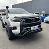 White toyota hilux with black off-road nudge bar lower style compatible with front camera and sensors and snorkel