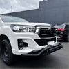 White toyota hilux with black lower style nudge bar compatible with front camera and sensors installed