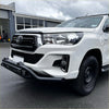 White toyota hilux with lower style black nudge bar compatible with front camera and sensors and chrome accents